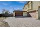 Two-car garage with paver driveway and landscaping at 4807 Enchanted View St, Las Vegas, NV 89149