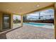 Covered patio with access to the pool and backyard at 4807 Enchanted View St, Las Vegas, NV 89149