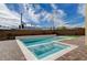 Modern rectangular pool and spa with brick patio at 4807 Enchanted View St, Las Vegas, NV 89149