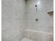 Walk-in shower with built-in seat and tile surround at 4807 Enchanted View St, Las Vegas, NV 89149