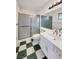 Bathroom with shower/tub combo and checkered floor at 4917 E Washington Ave, Las Vegas, NV 89110