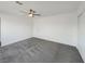 Spacious bedroom with gray carpet and ceiling fan at 4917 E Washington Ave, Las Vegas, NV 89110