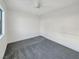 Simple bedroom with gray carpet and window at 4917 E Washington Ave, Las Vegas, NV 89110