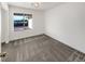 Simple bedroom with gray carpet and a window providing natural light at 4917 E Washington Ave, Las Vegas, NV 89110