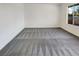 Bright bedroom with gray carpeting and large window at 4917 E Washington Ave, Las Vegas, NV 89110