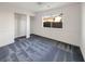 Bedroom with gray carpet, closet, and window at 4917 E Washington Ave, Las Vegas, NV 89110