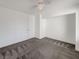 Well-lit bedroom with gray carpet and ceiling fan at 4917 E Washington Ave, Las Vegas, NV 89110