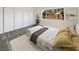 Virtually staged bedroom with a gray carpet and ample closet space at 4917 E Washington Ave, Las Vegas, NV 89110