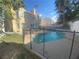 Inviting kidney shaped pool with safety fence in backyard at 503 Lariat Ln, Henderson, NV 89014