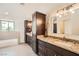 Bathroom features double vanity, granite countertop and large mirror at 503 Lariat Ln, Henderson, NV 89014