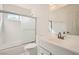 Clean bathroom with white subway tiles, a shower/tub combo, and modern vanity at 503 Lariat Ln, Henderson, NV 89014