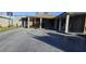 Covered front patio with rocking chairs and decorative flooring at 5162 Woodruff Pl, Las Vegas, NV 89120