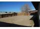 Large backyard with wooden fence and covered patio at 5175 Orinda Ave, Las Vegas, NV 89120