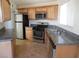 Galley kitchen with granite countertops and stainless steel appliances at 5175 Orinda Ave, Las Vegas, NV 89120