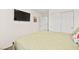 Bedroom with a large TV and ample closet space at 531 Thistleberry Ave, Henderson, NV 89044