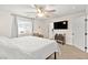 Serene bedroom with large bed, sitting area, and plenty of light at 531 Thistleberry Ave, Henderson, NV 89044