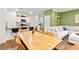 Bright dining area with a wood table and leather chairs, adjacent to kitchen at 531 Thistleberry Ave, Henderson, NV 89044