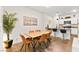 Dining room with light wood table, six tan chairs, and an open feel at 531 Thistleberry Ave, Henderson, NV 89044