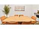 Modern dining area with a light wood table and tan leather chairs at 531 Thistleberry Ave, Henderson, NV 89044