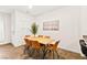 Bright dining area with wood table, tan chairs, and wood floors at 531 Thistleberry Ave, Henderson, NV 89044