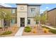 Two-story home with gray siding and landscaped front yard at 531 Thistleberry Ave, Henderson, NV 89044