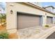 Attached garage with double doors and additional parking space at 531 Thistleberry Ave, Henderson, NV 89044