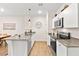 Modern kitchen with stainless steel appliances and hardwood floors at 531 Thistleberry Ave, Henderson, NV 89044