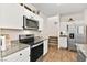 Modern kitchen with stainless steel appliances and granite countertops at 531 Thistleberry Ave, Henderson, NV 89044