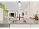 Modern kitchen island with granite countertop and stainless steel sink at 531 Thistleberry Ave, Henderson, NV 89044