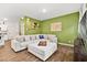 Bright living room with sectional sofa, fireplace, and wood floors at 531 Thistleberry Ave, Henderson, NV 89044