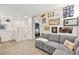 Cozy sitting area with sectional sofa and gallery wall at 531 Thistleberry Ave, Henderson, NV 89044