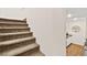 Carpeted staircase leading to the upper level of the home at 531 Thistleberry Ave, Henderson, NV 89044