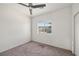 Bright bedroom with carpet flooring and a window offering natural light at 5338 Lignum Ave, Pahrump, NV 89061