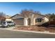 Single-story house with a two-car garage and well-maintained landscaping at 5338 Lignum Ave, Pahrump, NV 89061