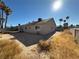 Sunny backyard with a trampoline and desert landscaping at 5640 Judith Resnik Ct, Las Vegas, NV 89103