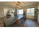 Dining area with large farmhouse table and modern lighting at 5640 Judith Resnik Ct, Las Vegas, NV 89103