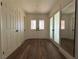 Light and airy entryway, featuring wood-look floors and white doors at 5640 Judith Resnik Ct, Las Vegas, NV 89103