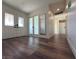 Bright entryway with wood-look floors, double doors, and a full-length mirror at 5640 Judith Resnik Ct, Las Vegas, NV 89103