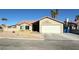 Single story home with attached garage and desert landscaping at 5640 Judith Resnik Ct, Las Vegas, NV 89103