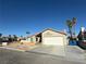 House exterior with a single car garage at 5640 Judith Resnik Ct, Las Vegas, NV 89103