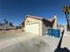 Single car garage with attached driveway at 5640 Judith Resnik Ct, Las Vegas, NV 89103