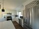 Modern kitchen with white cabinets, quartz counters, and stainless steel appliances at 5640 Judith Resnik Ct, Las Vegas, NV 89103