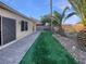 Landscaped backyard with artificial turf at 5932 Quintillion Ave, Las Vegas, NV 89122