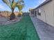 Landscaped backyard with artificial turf at 5932 Quintillion Ave, Las Vegas, NV 89122