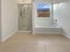 Bathroom with shower, bathtub, and tile floors at 5932 Quintillion Ave, Las Vegas, NV 89122