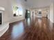 Living room with hardwood floors, fireplace and kitchen view at 5932 Quintillion Ave, Las Vegas, NV 89122