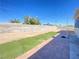 Spacious backyard with artificial turf and patio at 6124 Jones Cir, Las Vegas, NV 89107