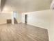 Spacious basement Gathering room with new wood-look flooring at 6124 Jones Cir, Las Vegas, NV 89107