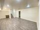 Spacious basement Gathering room with new wood-look flooring at 6124 Jones Cir, Las Vegas, NV 89107