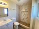 Updated bathroom with marble shower and white vanity at 6124 Jones Cir, Las Vegas, NV 89107